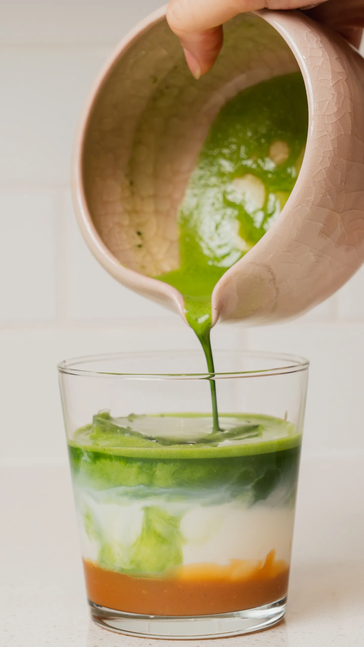 Matcha poured over milk at Umami Matcha